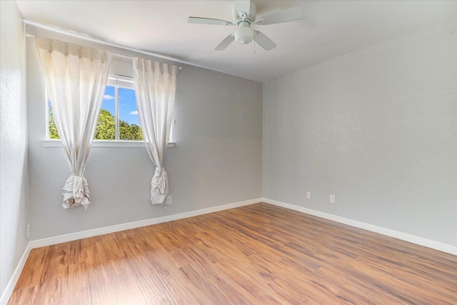 1403 Terrapin Ct, Austin, TX 78746 - unfurnished room with wood finished floors, baseboards, and a ceiling fan