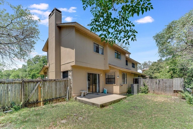 1403 Terrapin Ct, Austin, TX 78746 - rear view of house with a chimney, a patio area, a gate, and central AC