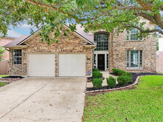 1252 Fall Creek Loop, Cedar Park, TX 78613 - traditional-style home featuring an attached garage, driveway, brick siding, and a shingled roof