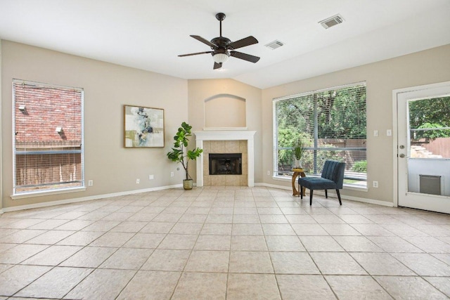 1252 Fall Creek Loop, Cedar Park, TX 78613 - living room featuring a ceiling fan, a tile fireplace, light tile patterned flooring, and lofted ceiling