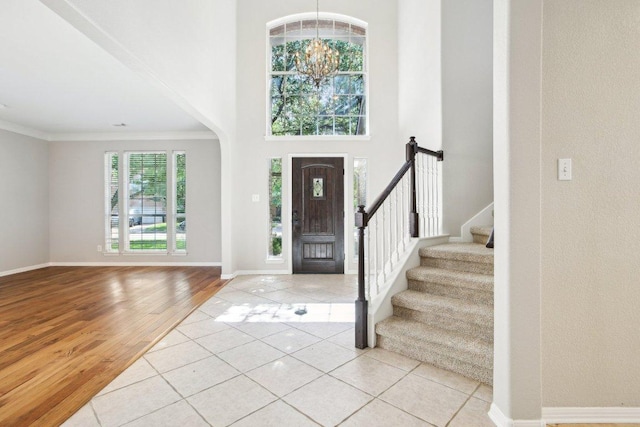 1252 Fall Creek Loop, Cedar Park, TX 78613 - tiled entryway featuring stairs, crown molding, and a high ceiling