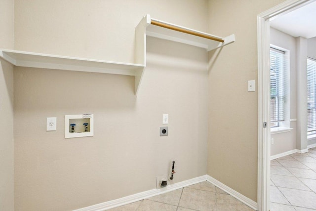 1252 Fall Creek Loop, Cedar Park, TX 78613 - washroom featuring electric dryer hookup, washer hookup, light tile patterned flooring, hookup for a gas dryer, and baseboards