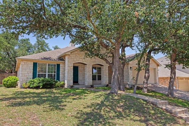 1129 Wigwam Dr, Leander, TX 78641 - view of front of house with stone siding, a garage, driveway, roof with shingles, and a chimney