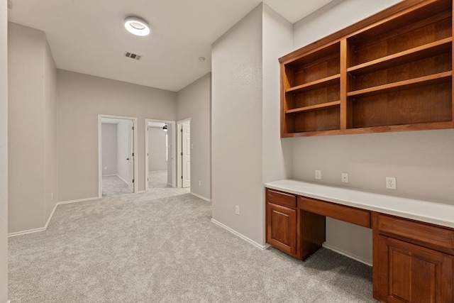 1129 Wigwam Dr, Leander, TX 78641 - unfurnished office featuring built in desk and light carpet