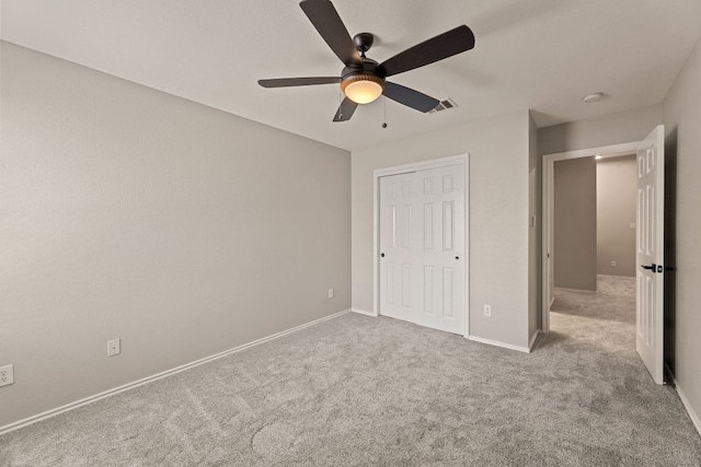 1129 Wigwam Dr, Leander, TX 78641 - unfurnished bedroom featuring carpet, a ceiling fan, and a closet