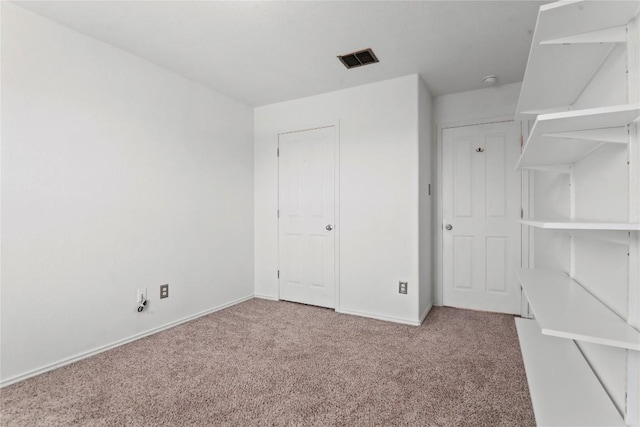 232 Wells Bnd, Hutto, TX 78634 - unfurnished bedroom with light colored carpet and baseboards