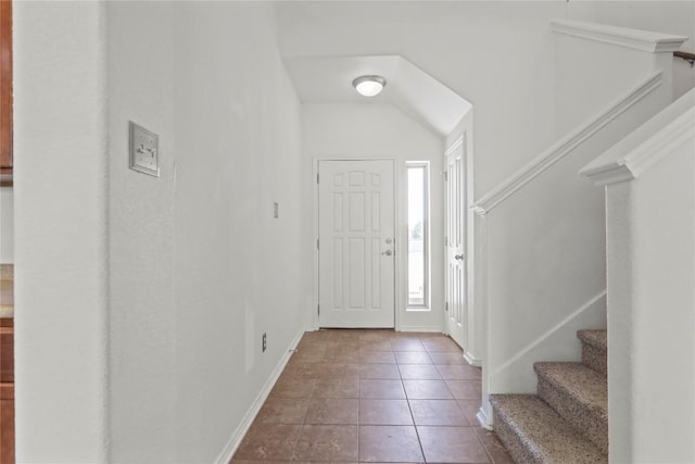 232 Wells Bnd, Hutto, TX 78634 - tiled entryway with stairs and baseboards