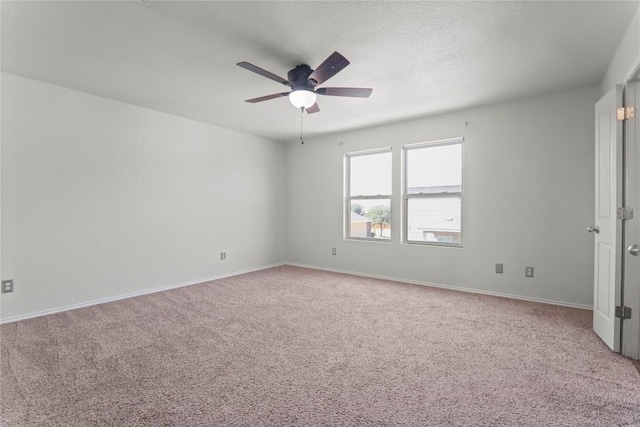 232 Wells Bnd, Hutto, TX 78634 - spare room featuring light carpet, ceiling fan, and baseboards