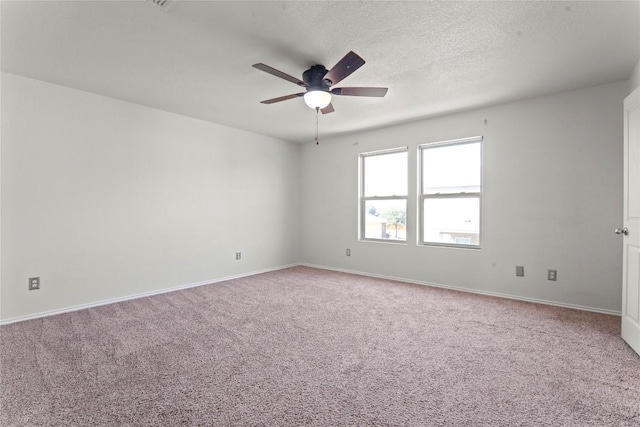 232 Wells Bnd, Hutto, TX 78634 - empty room featuring a ceiling fan, light carpet, baseboards, and a textured ceiling