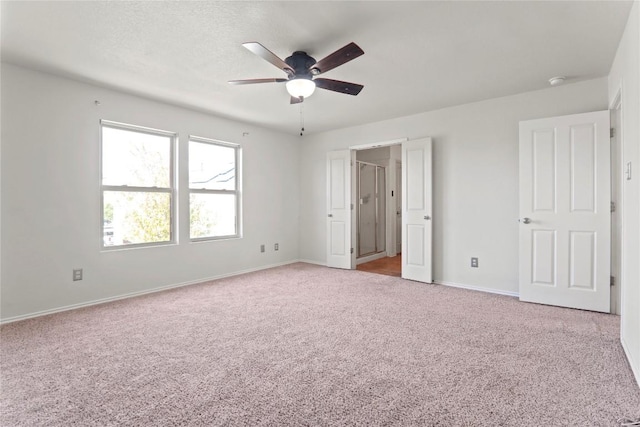 232 Wells Bnd, Hutto, TX 78634 - unfurnished bedroom featuring carpet flooring, baseboards, and ceiling fan