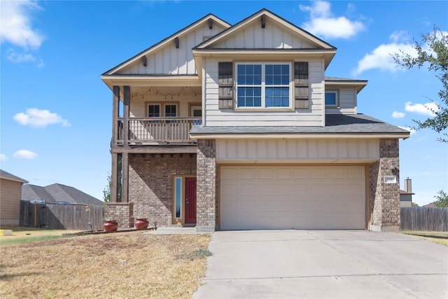 232 Wells Bnd, Hutto, TX 78634 - view of front of house featuring board and batten siding, a garage, driveway, a balcony, and roof with shingles