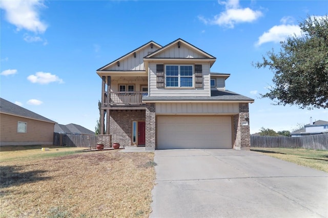 232 Wells Bnd, Hutto, TX 78634 - view of front of property featuring board and batten siding, an attached garage, and concrete driveway