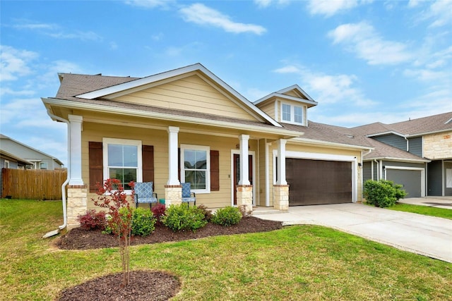 107 Denton Dr, Hutto, TX 78634 - craftsman-style home featuring covered porch, driveway, a shingled roof, and a garage