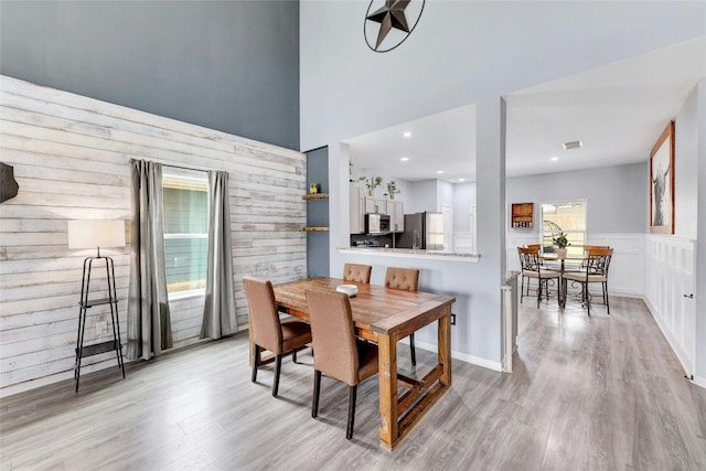 107 Denton Dr, Hutto, TX 78634 - dining room with light wood-style floors and a towering ceiling