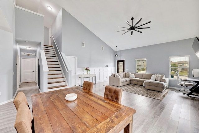 107 Denton Dr, Hutto, TX 78634 - dining space featuring high vaulted ceiling, stairway, light wood-style flooring, and ceiling fan