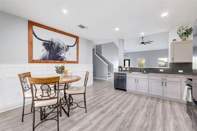 107 Denton Dr, Hutto, TX 78634 - kitchen featuring dishwashing machine, a ceiling fan, light wood-type flooring, recessed lighting, and a wainscoted wall