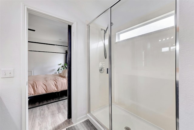 107 Denton Dr, Hutto, TX 78634 - ensuite bathroom with a stall shower and wood finished floors