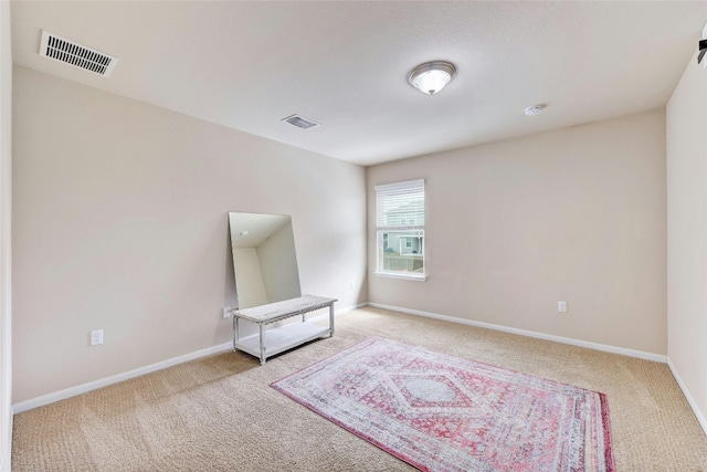 107 Denton Dr, Hutto, TX 78634 - carpeted empty room with baseboards and a smoke detector