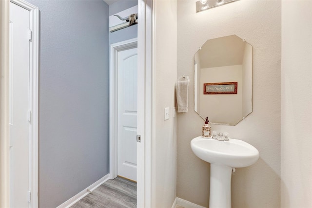107 Denton Dr, Hutto, TX 78634 - bathroom with wood finished floors and baseboards