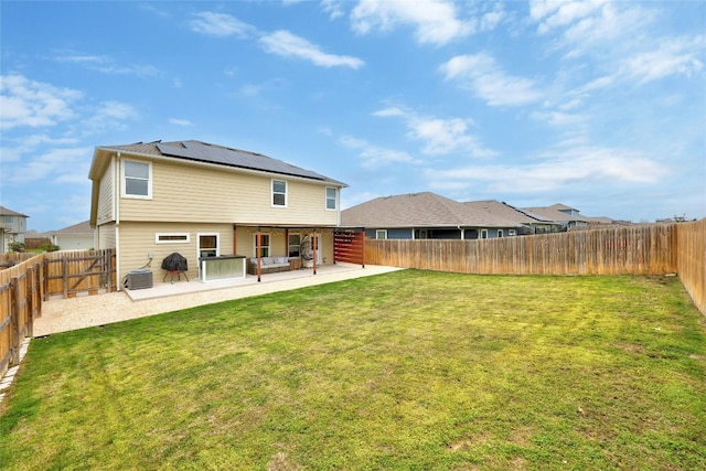 107 Denton Dr, Hutto, TX 78634 - rear view of house featuring a patio area, solar panels, and a fenced backyard
