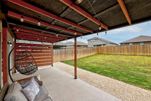 107 Denton Dr, Hutto, TX 78634 - fenced backyard with a patio area