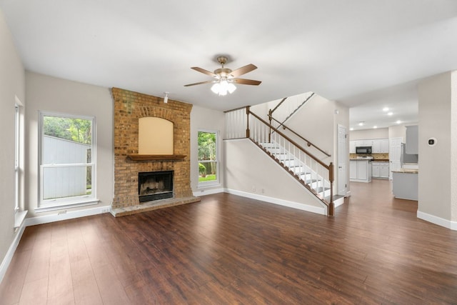 2308 Falcon Dr, Round Rock, TX 78681 - unfurnished living room with stairs, healthy amount of natural light, a ceiling fan, and dark wood finished floors