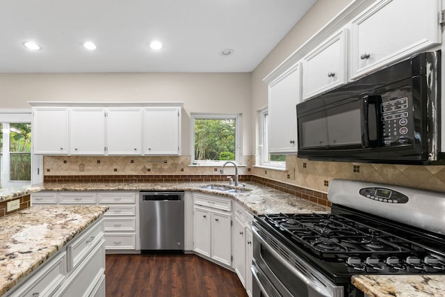 2308 Falcon Dr, Round Rock, TX 78681 - kitchen with stainless steel appliances, a sink, white cabinetry, backsplash, and recessed lighting
