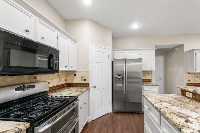 2308 Falcon Dr, Round Rock, TX 78681 - kitchen featuring stainless steel appliances, white cabinets, dark wood-type flooring, backsplash, and light stone countertops