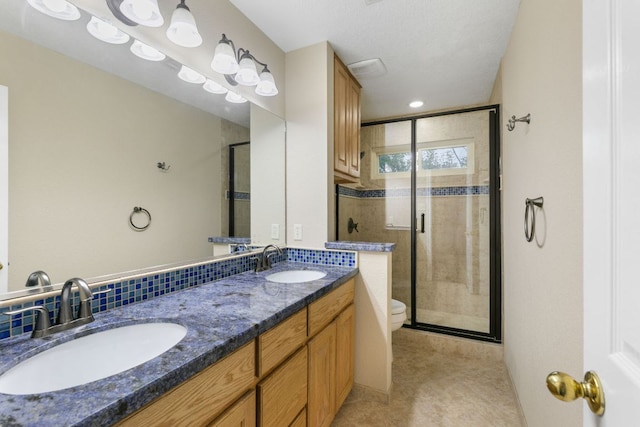 2308 Falcon Dr, Round Rock, TX 78681 - full bath with toilet, a shower stall, and double vanity