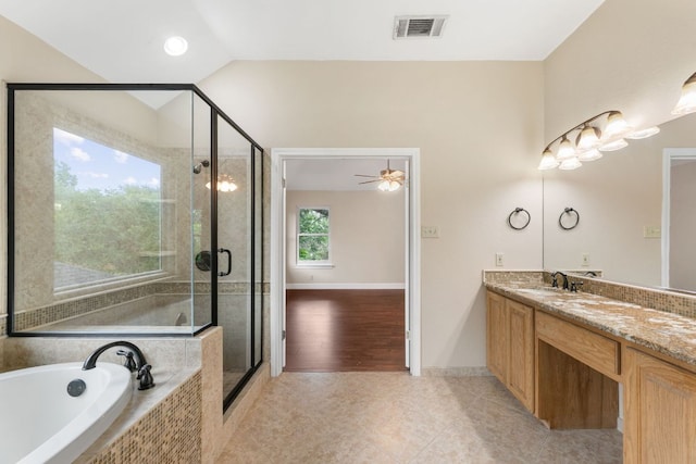 2308 Falcon Dr, Round Rock, TX 78681 - bathroom with vanity, a garden tub, a shower stall, tile patterned flooring, and a ceiling fan