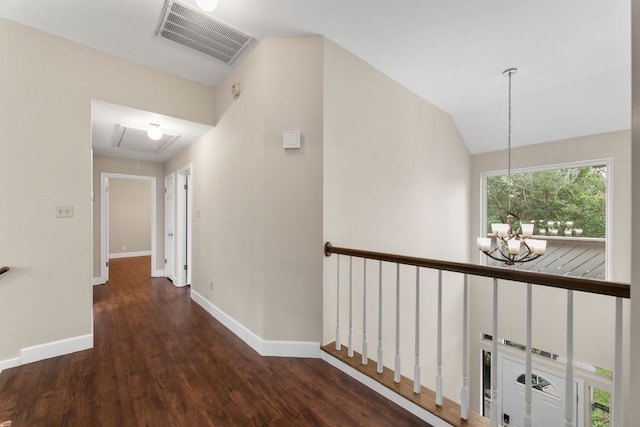 2308 Falcon Dr, Round Rock, TX 78681 - hall featuring attic access, a chandelier, baseboards, wood finished floors, and lofted ceiling