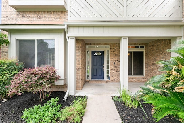 2308 Falcon Dr, Round Rock, TX 78681 - view of exterior entry with brick siding and a porch