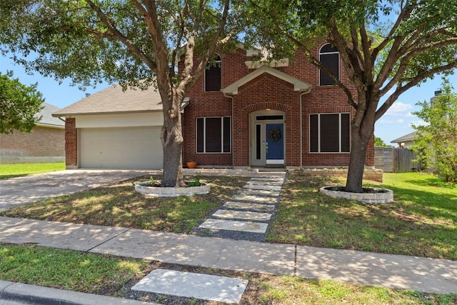 320 Ranier Ln, Round Rock, TX 78665 - view of front facade featuring a garage, brick siding, and driveway