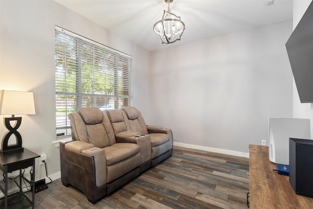 320 Ranier Ln, Round Rock, TX 78665 - sitting room with dark wood-style flooring, a chandelier, and baseboards