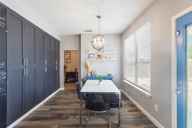 320 Ranier Ln, Round Rock, TX 78665 - dining space featuring a chandelier, dark wood-type flooring, healthy amount of natural light, and a desk