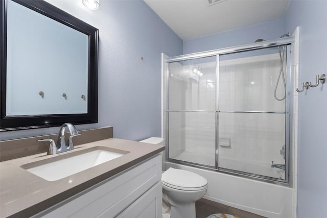 320 Ranier Ln, Round Rock, TX 78665 - bathroom with vanity, toilet, and enclosed tub / shower combo