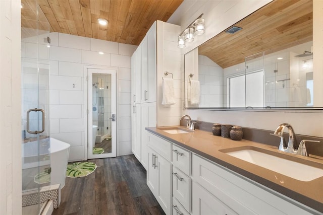 320 Ranier Ln, Round Rock, TX 78665 - full bathroom with wooden ceiling, double vanity, a stall shower, wood finished floors, and lofted ceiling