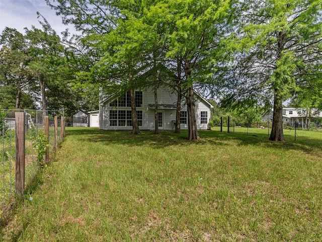 2939 Jeffcote Rd, Conroe, TX 77303 - view of yard with a garage