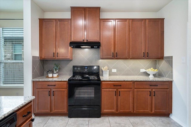 16513 Brogan Ln, Pflugerville, TX 78660 - kitchen featuring black appliances, under cabinet range hood, decorative backsplash, and light stone counters