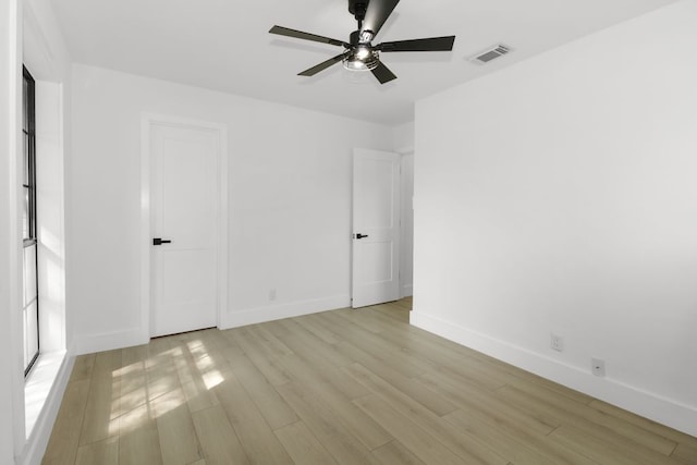 1509 Parkview Ln, San Marcos, TX 78666 - empty room featuring light wood-style flooring, ceiling fan, and baseboards