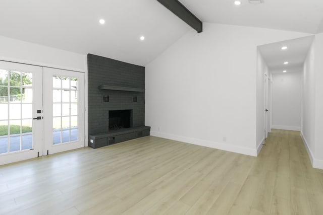 1509 Parkview Ln, San Marcos, TX 78666 - unfurnished living room with light wood-type flooring, recessed lighting, a brick fireplace, french doors, and baseboards