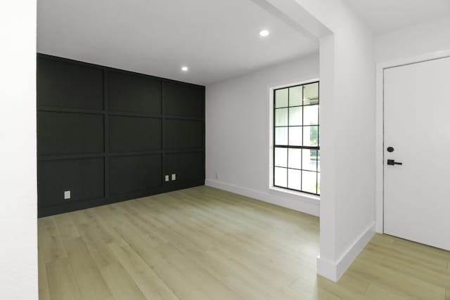 1509 Parkview Ln, San Marcos, TX 78666 - entrance foyer featuring light wood-style floors, a decorative wall, recessed lighting, and baseboards
