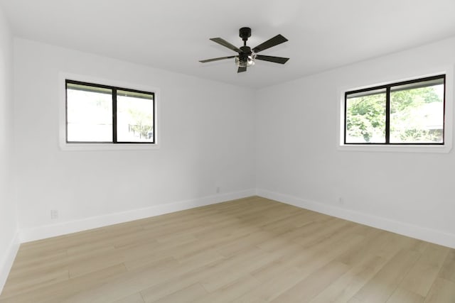 1509 Parkview Ln, San Marcos, TX 78666 - empty room featuring healthy amount of natural light, light wood-type flooring, baseboards, and a ceiling fan