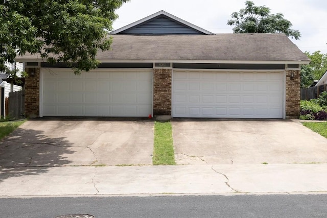 2625 Gwendolyn Ln, Austin, TX 78748 - view of front of home featuring brick siding, a garage, and driveway