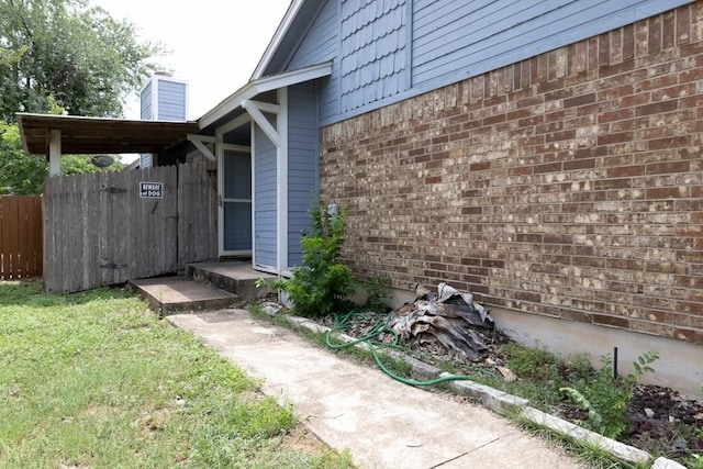 2625 Gwendolyn Ln, Austin, TX 78748 - entrance to property featuring brick siding and a chimney
