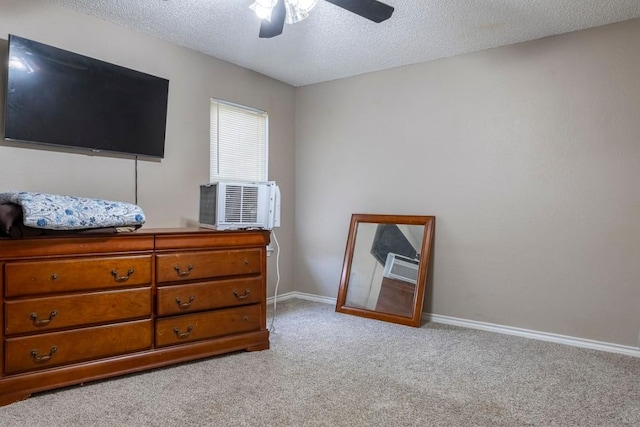 2625 Gwendolyn Ln, Austin, TX 78748 - carpeted bedroom featuring a textured ceiling, baseboards, ceiling fan, and cooling unit