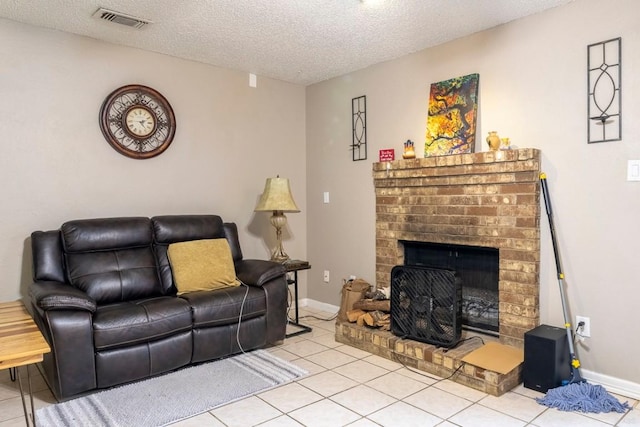 2625 Gwendolyn Ln, Austin, TX 78748 - tiled living area featuring a fireplace, a textured ceiling, and baseboards