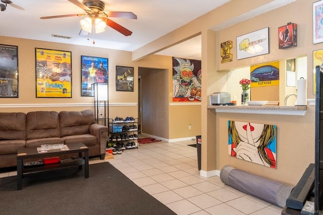 2625 Gwendolyn Ln, Austin, TX 78748 - living room with ceiling fan, light tile patterned floors, and baseboards