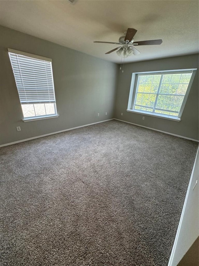 10301 Beard Ave, Austin, TX 78748 - carpeted empty room featuring a ceiling fan and baseboards