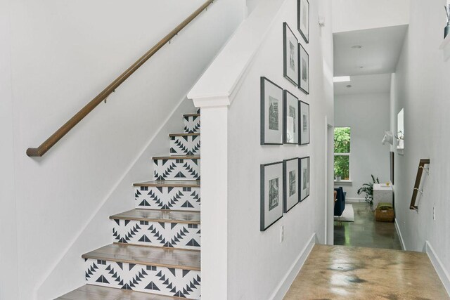 3001 Del Curto Rd Unit 14, Austin, TX 78704 - stairs with a high ceiling and baseboards